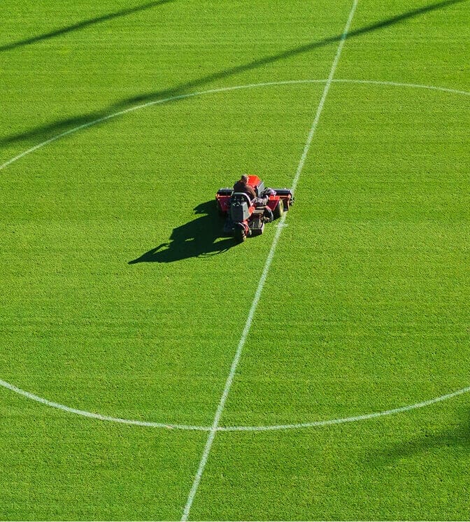 applying turf product on sports field